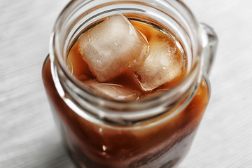 Cold coffee on wooden table