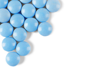 Blue pills on white background