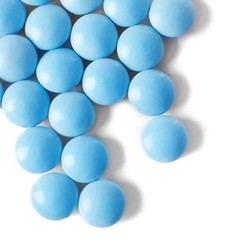 Blue pills on white background