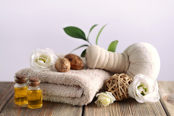 Spa composition with towel on light background