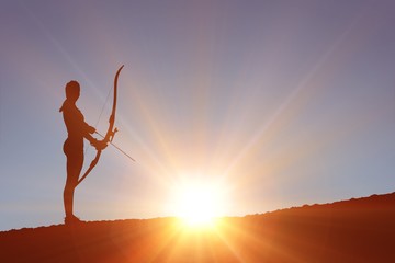 Composite image of sportswoman practicing archery