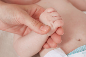 Child hand holding parent hand, closeup