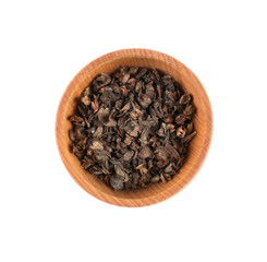 Dried basil (rayhon) in small wooden bowl isolated on white