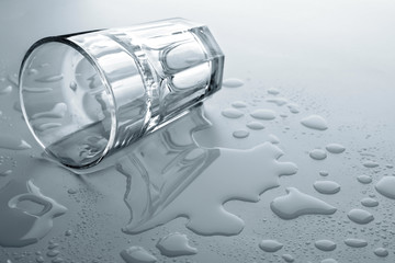 Glass and water on the light background