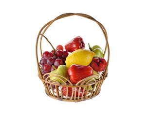 mixed fruits in rattan basket on white background