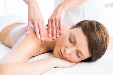 Beautiful woman receiving back massage