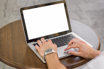 Man's hands typing on laptop keyboard, isolated screen