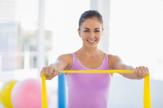 Portrait Of Happy Woman With Resistance Band