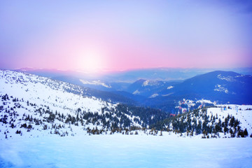 Sunrise and snowy mountains in wintertime
