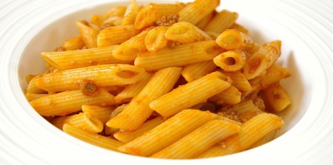 pasta bolognese on a white plate