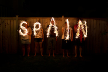 The word Spain in sparklers time lapse photography