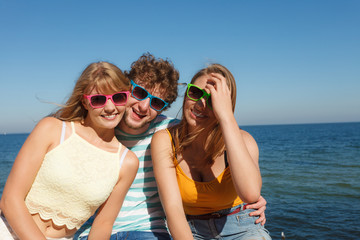 Group friends boy two girls having fun outdoor