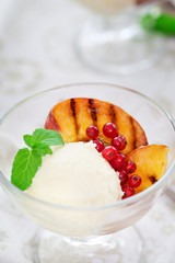 Homemade Peach Ice Cream with currant and mint
