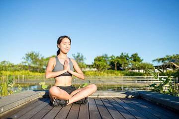 Fototapeta na wymiar Young woman practicing meditation