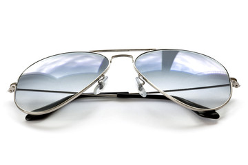Blue aviator sunglasses on white