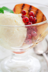 Homemade Peach Ice Cream with currant and mint