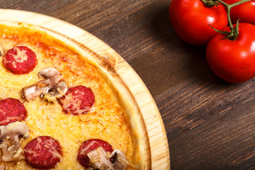 Delicious italian pizzas served on wooden table