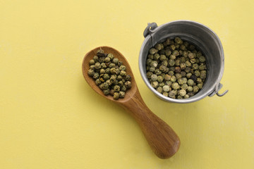 Wood spoon and metal bucket
