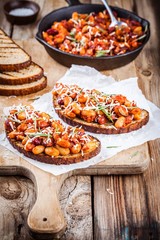 baked beans with rosemary and parmesan on toast