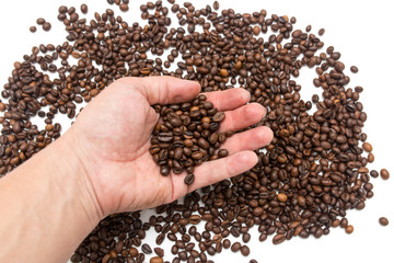 hand on coffee beans as background
