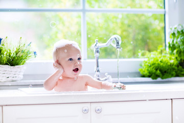 Little baby taking bath