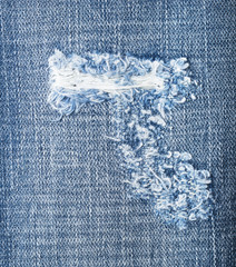Blue torn denim jeans texture with space for text