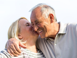 Senior couple embracing each other.