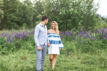 happy young couple man and woman walking in nature, concept of l