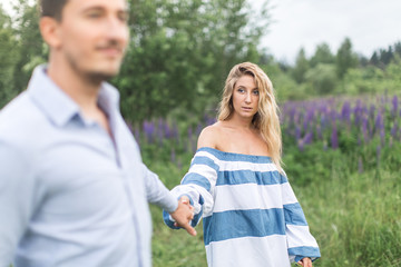 happy young couple man and woman walking in nature, concept of l