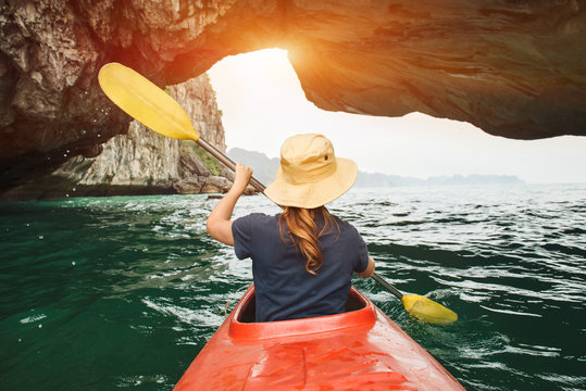 Woman explore Ha Long Bay on kayak