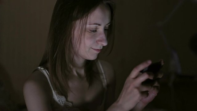 Attractive, young woman browsing photos or internet