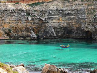 small fisherman's boat in a wonderful bay Gozo Malta