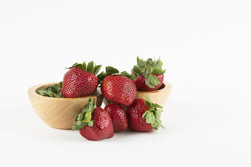 Strawberry arrangement on a bright white background and two bowls