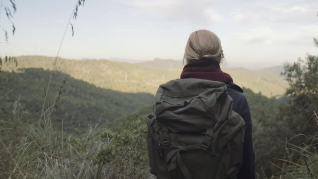 Young Adult Female Traveling and taking picture on view point