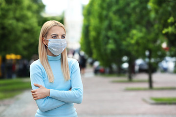 Woman in protective mask outdoors