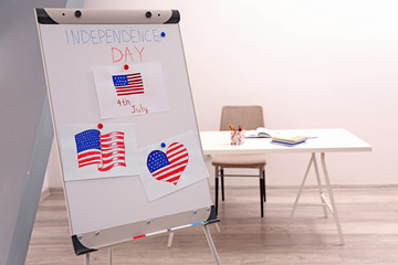 Child's drawings of American flag on flip chart