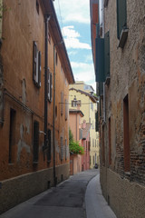 Fototapeta na wymiar Bologna, Italy - June, 18, 2016: street in a center of an old town in Bologna, Italy