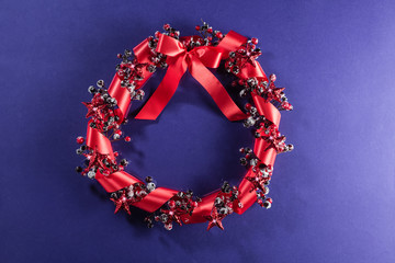 Christmas wreath in red with ribbon
