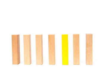 a line of wooden toy blocks on white background