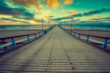 Cercles muraux Ville sur leau Perspective view of wooden pier over sea. Palanga city at sunset in autumn, Lithuania