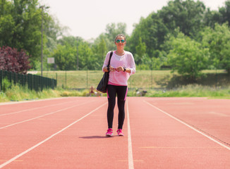 Fototapeta premium Athletic girl walking sport running tracks