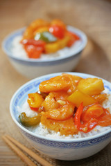 sweet and sour shrimp. deep fried crispy prawn stir fried with pineapple and fresh capsicum in sour and sweet sauce. worldwide famous chinese cuisine.