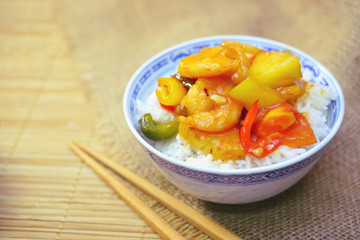 sweet and sour shrimp. deep fried crispy prawn stir fried with pineapple and fresh capsicum in sour and sweet sauce. worldwide famous chinese cuisine.