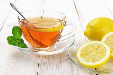 Tea in glass cup with lemon