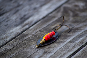 Fishing tackle on wooden background