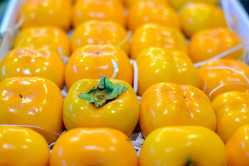 Persimmons fruit at the farmers market
