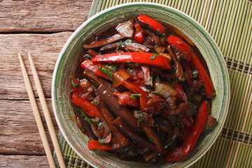 Eggplant Stir-Fry from Asian-style close-up on a plate. horizontal top view
