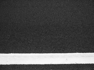 closeup new white line on the road texture