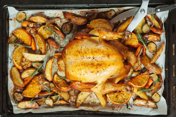 Roasted chicken with orange and apple