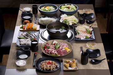 Saigon, Vietnam - June 2, 2016: A traditional Japanese style of hot pot are being served on the table in a Vietnamese restaurant